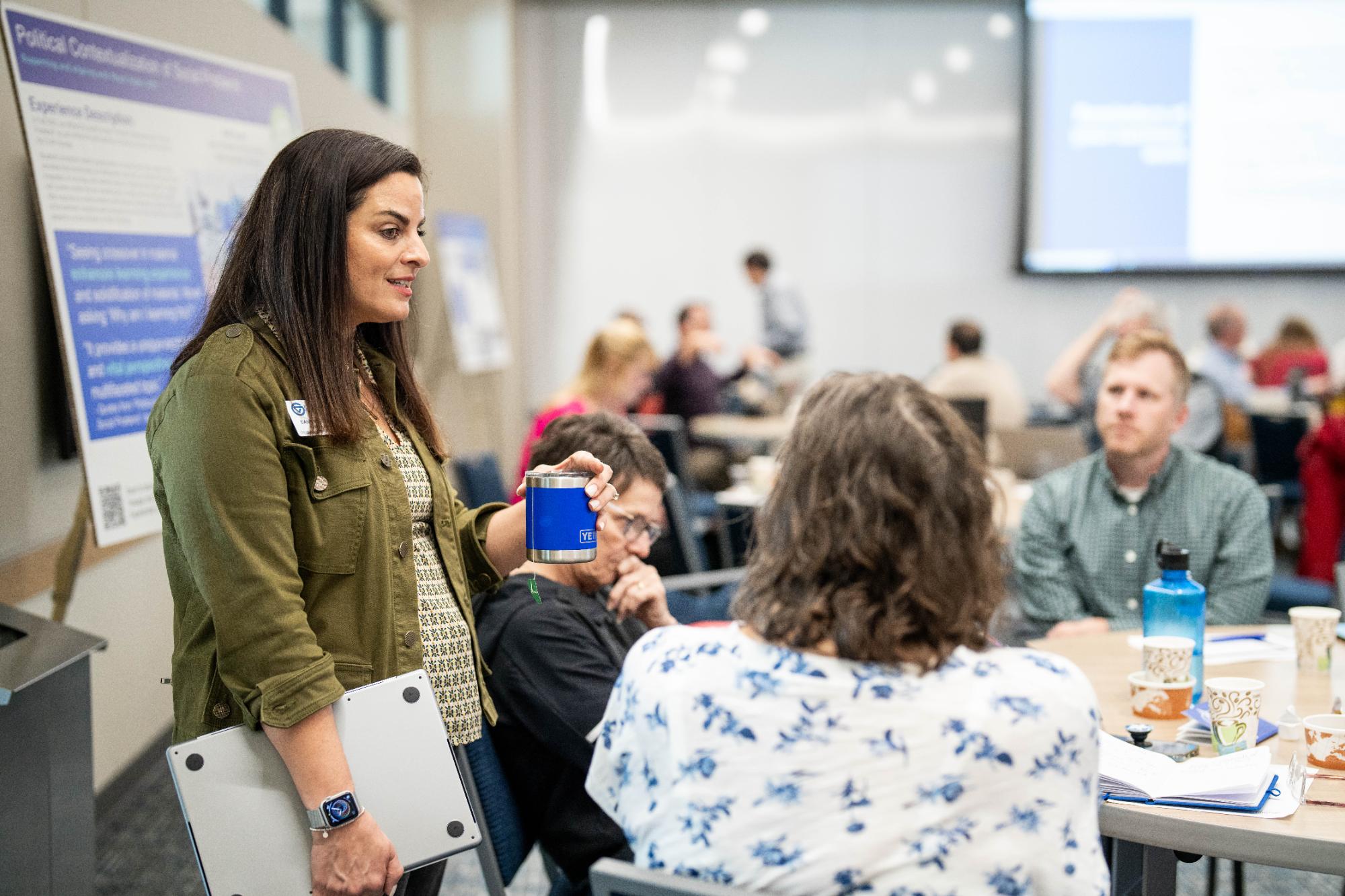 Image of CCEL staff member talking with faculty